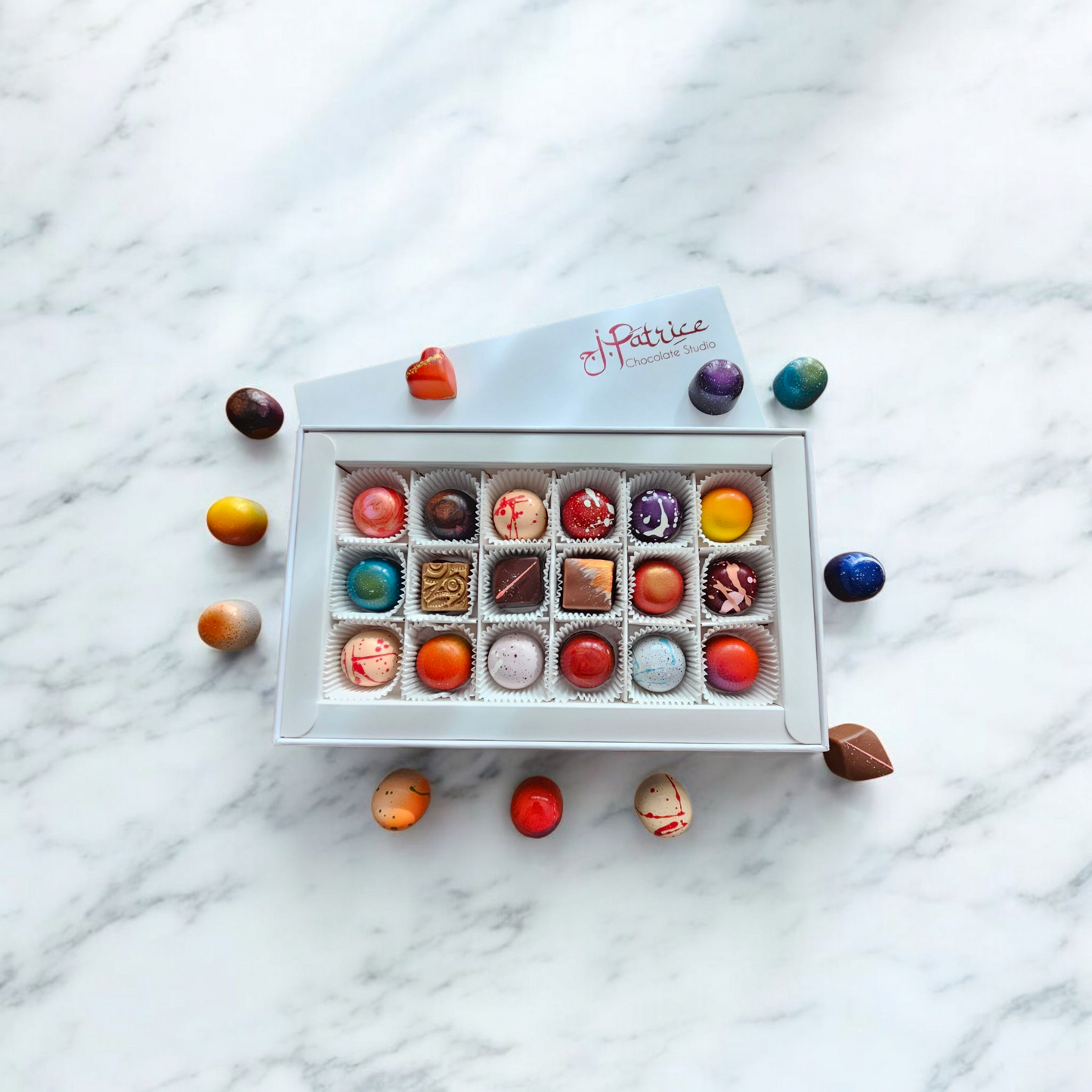 Elegant 18-piece chocolate box with marble backdrop