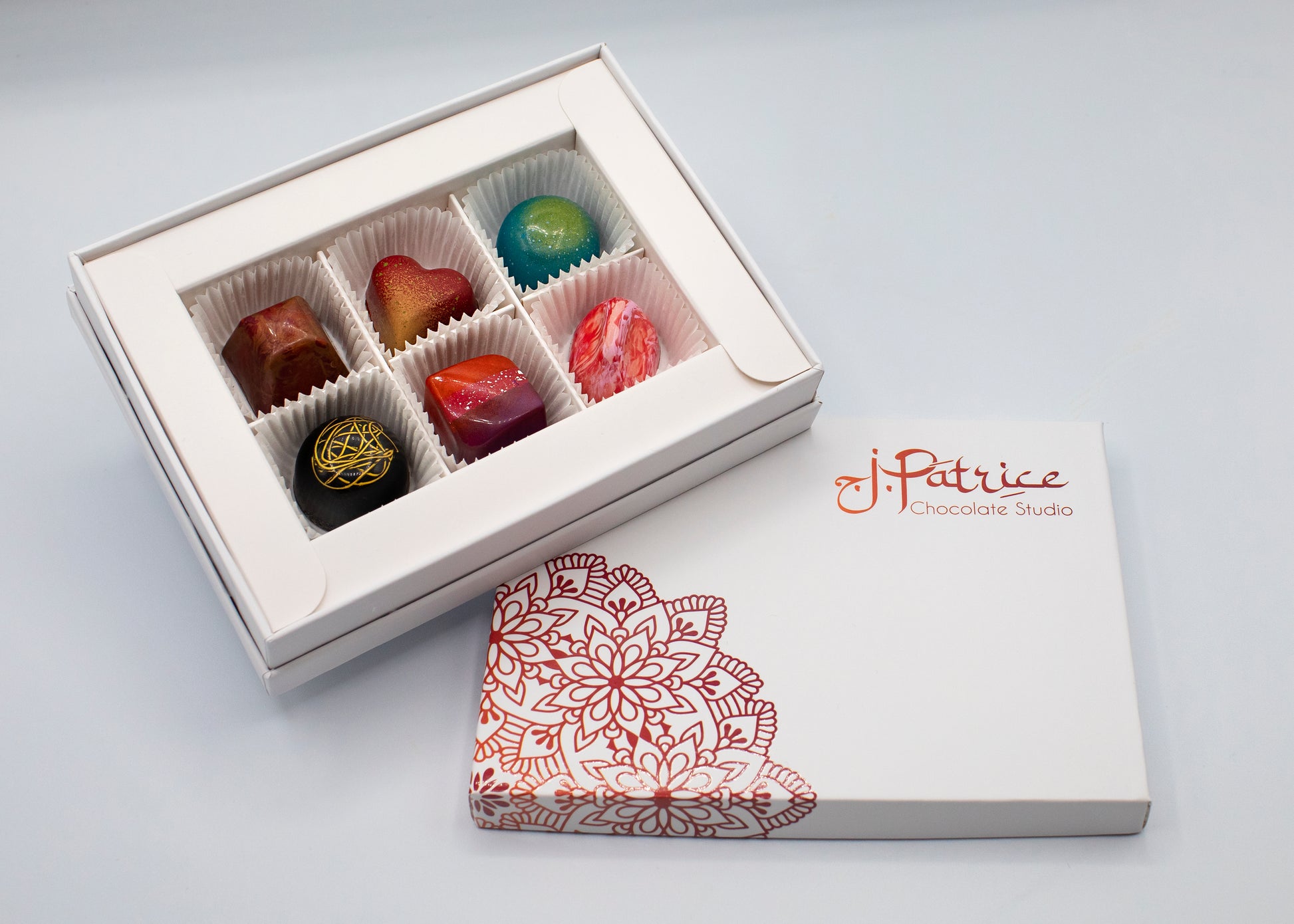 6 Piece Exotic BonBon Collection Box featuring a selection of unique and adventurous flavors.