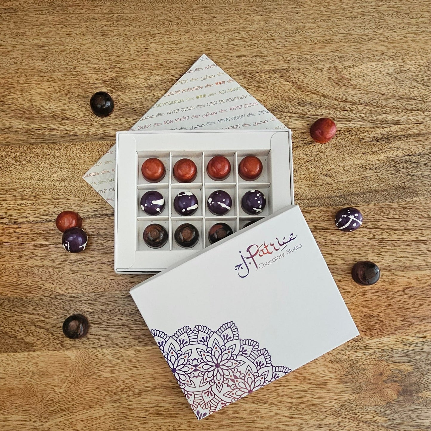 12 Piece Vegan Collection Box filled with a variety of rich, dairy-free chocolates.