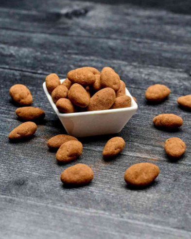 Milk Chocolate Coffee Almonds featuring crunchy almonds coated in rich milk chocolate with a bold coffee flavor.