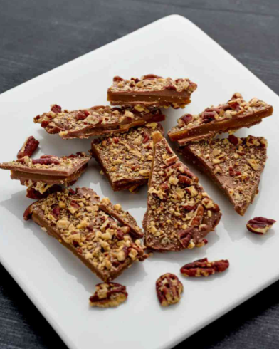 Milk Chocolate Pecan Toffee Bark featuring crunchy toffee and pecans coated in creamy milk chocolate.