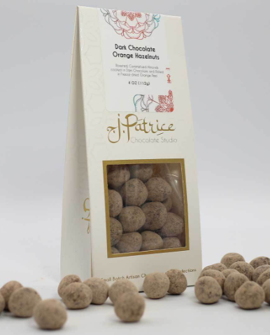 Zesty Dark Chocolate Orange Hazelnuts combining smooth chocolate, vibrant orange, and crunchy hazelnuts.