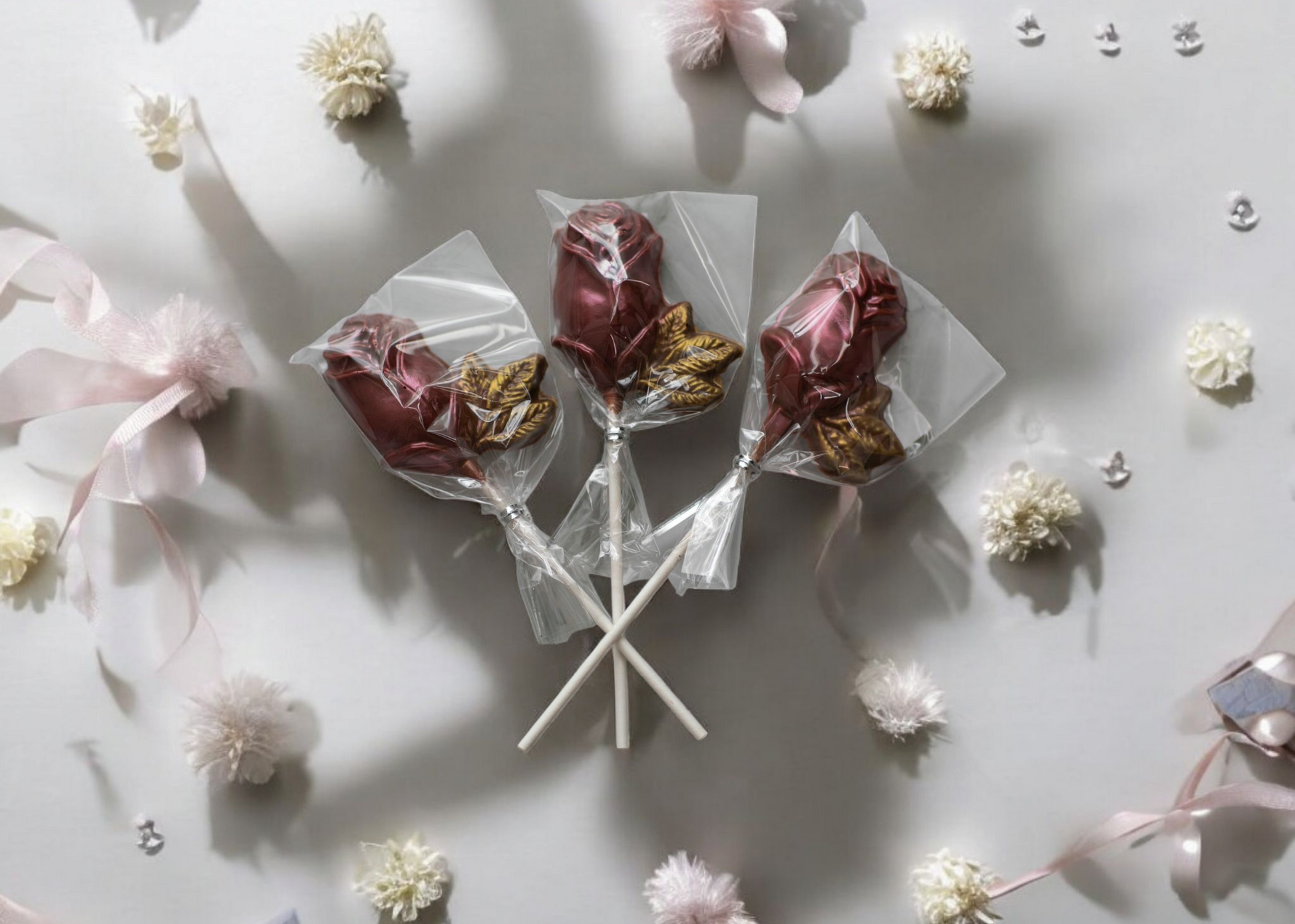 Chocolate rose lollipops in pink and red
