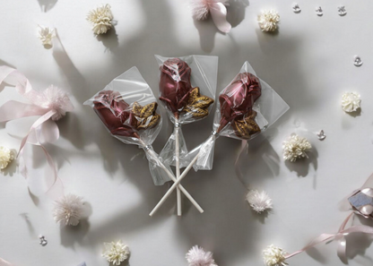 Chocolate rose lollipops in pink and red